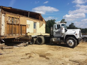 Yde house loaded on a transporter, 2015