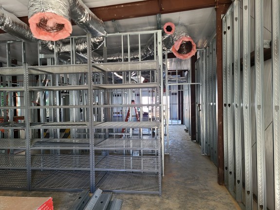 Steel shelving going up